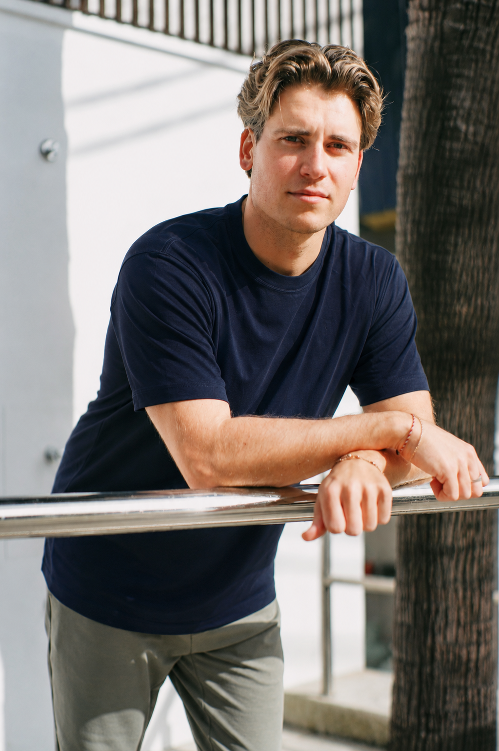 Navy Premium Heavyweight Cotton T-Shirt close-up on model, showing crew neck collar detail