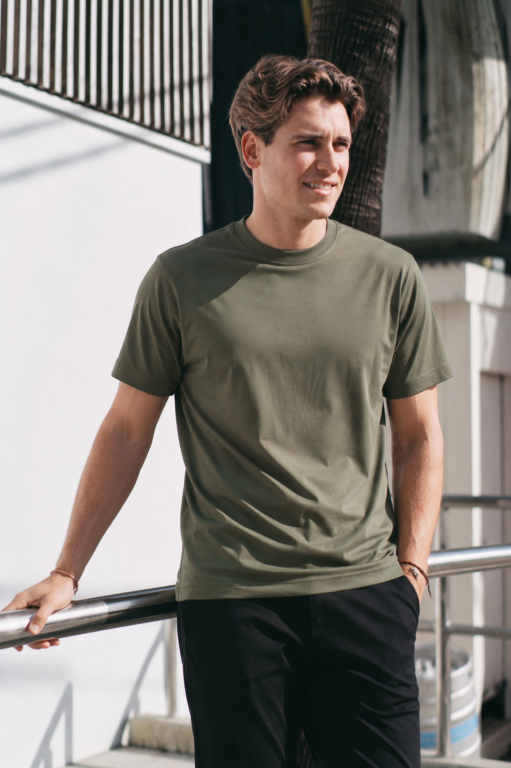 Military green Premium Heavyweight Cotton T-Shirt on model, relaxed casual standing pose