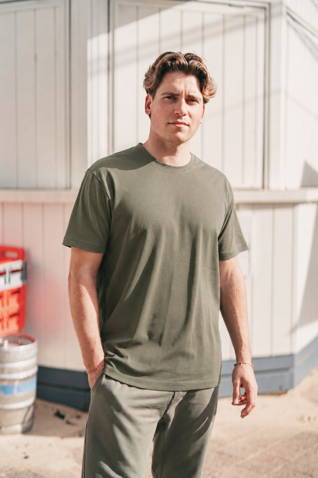 Men's military green Premium Heavyweight Cotton T-Shirt front view, showing fit on model